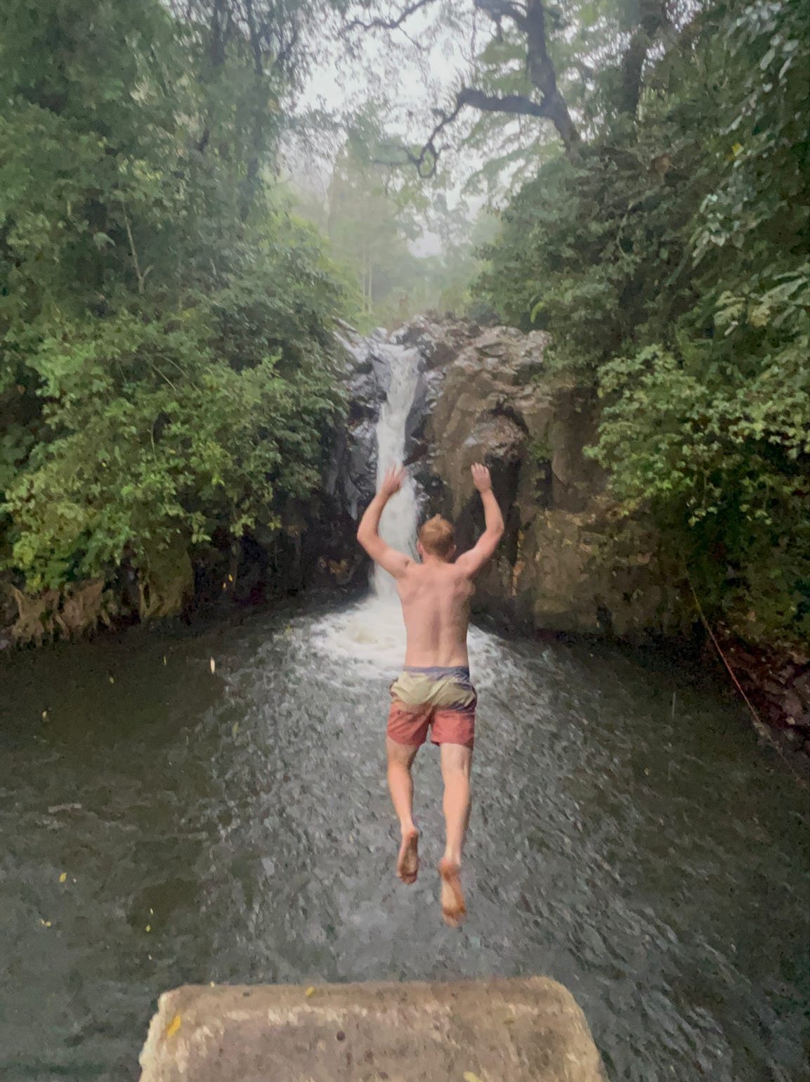 Jack of Ourtwostepstart Jumping from one of the Aling Aling waterfall jumps!