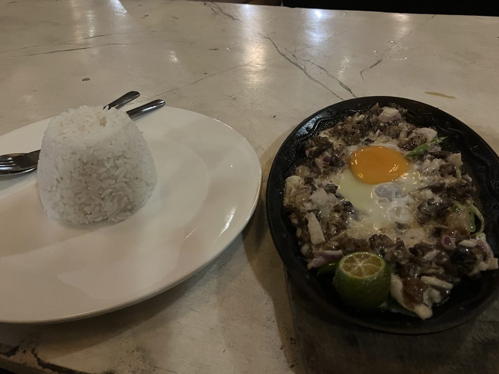 Pork Sisig meal at Outpost Hostel